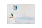 Kylie Supreme Mac Bed Pad with Tuck Ins laid across a made bed
