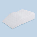 TheraMed Leg Relaxer Support Pillow in quilted cover, angled view