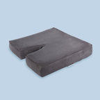 TheraMed Coccyx Diffuser Cushion in grey cover showing the coccyx cut-out