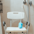 Aspire Homecare Shower Chair in a bathroom beside a grab rail