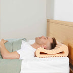 Man lying on his back on the TheraMed Sleeprrr Plus Pillow (Medium)