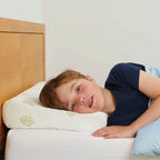 Child sleeping on his side on the TheraMed Naturelle Latex Pillow (Child)
